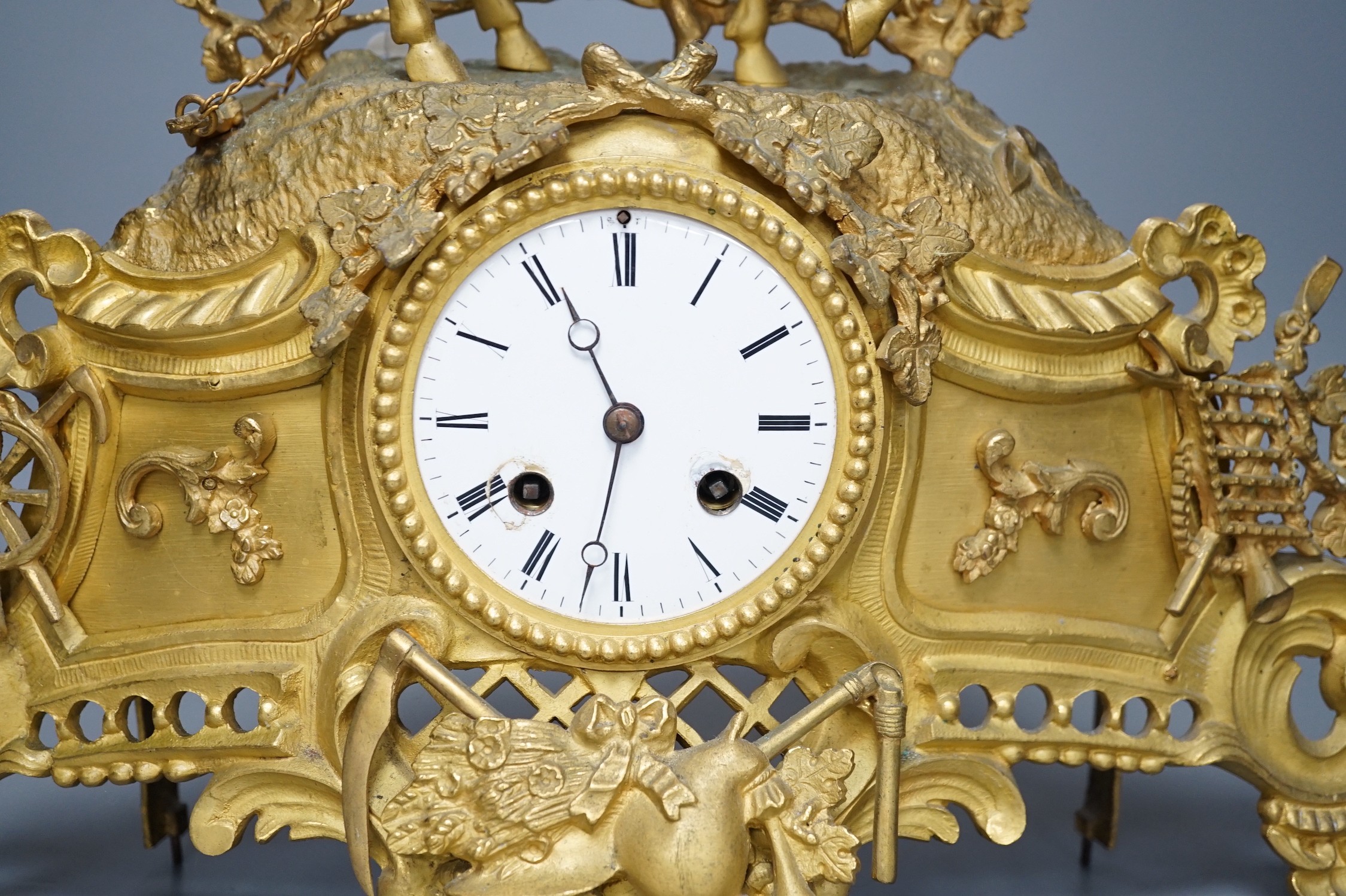 A Louis XV style gilt metal cased eight day mantel clock, 37cm tall